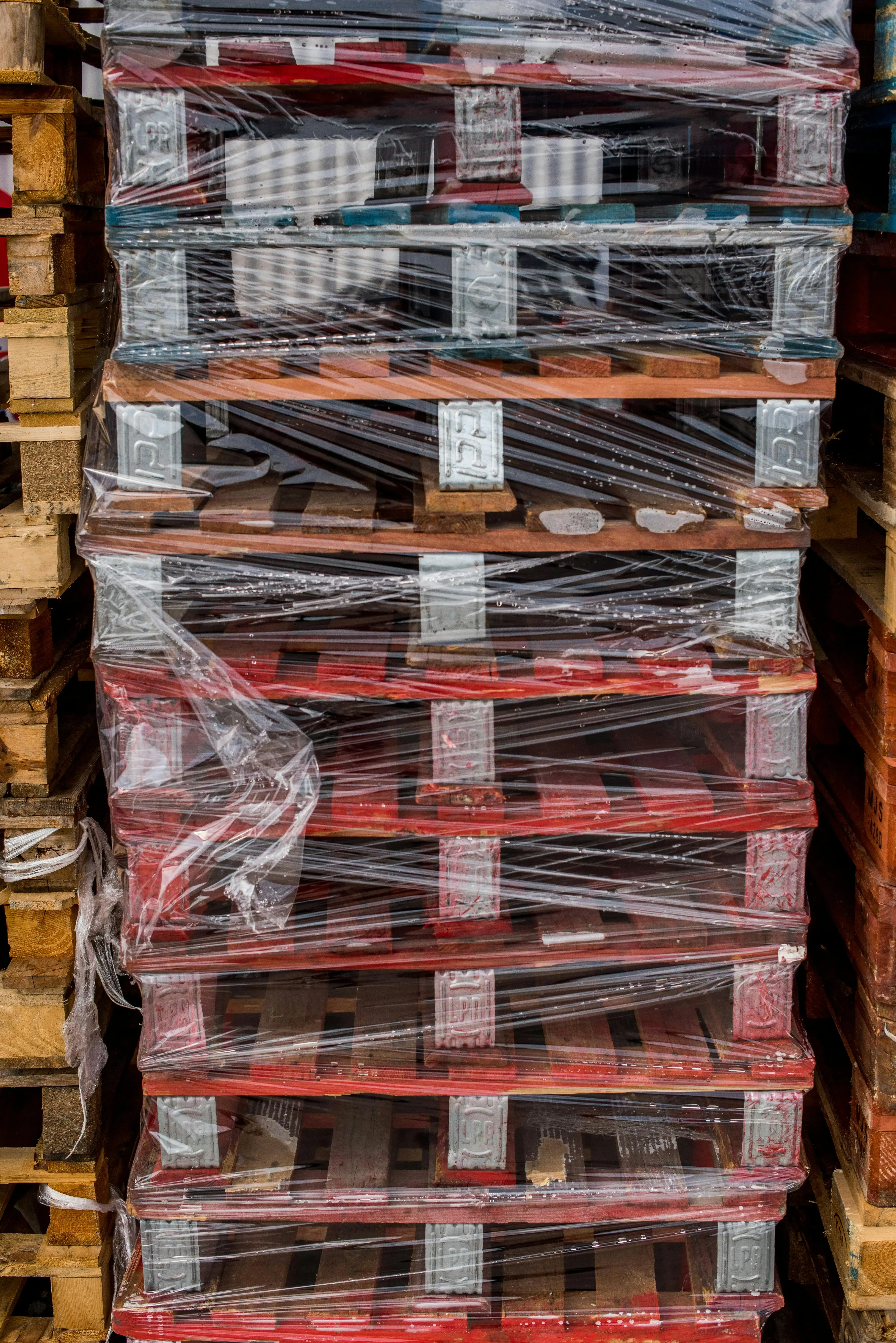 Stacked Wooden Pallets Wrapped in Plastic